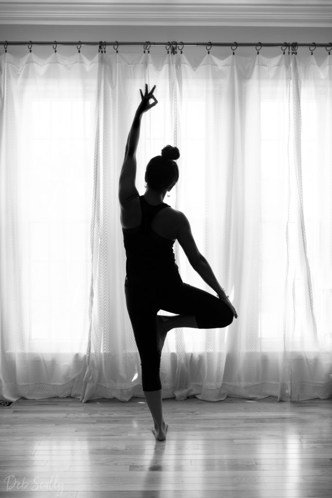 Warrior I with mudra pose in Nashville yoga photographer branding session in Nashville TN with Whitney Korman