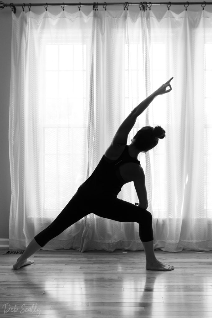 Warrior I with mudra pose in Nashville yoga photographer branding session in Nashville TN with Whitney Korman