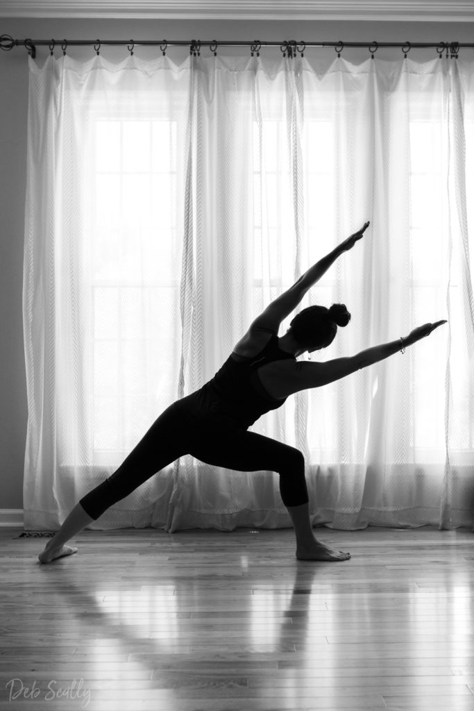 Extended side angle pose in Nashville yoga photographer branding session in Nashville TN with Whitney Korman