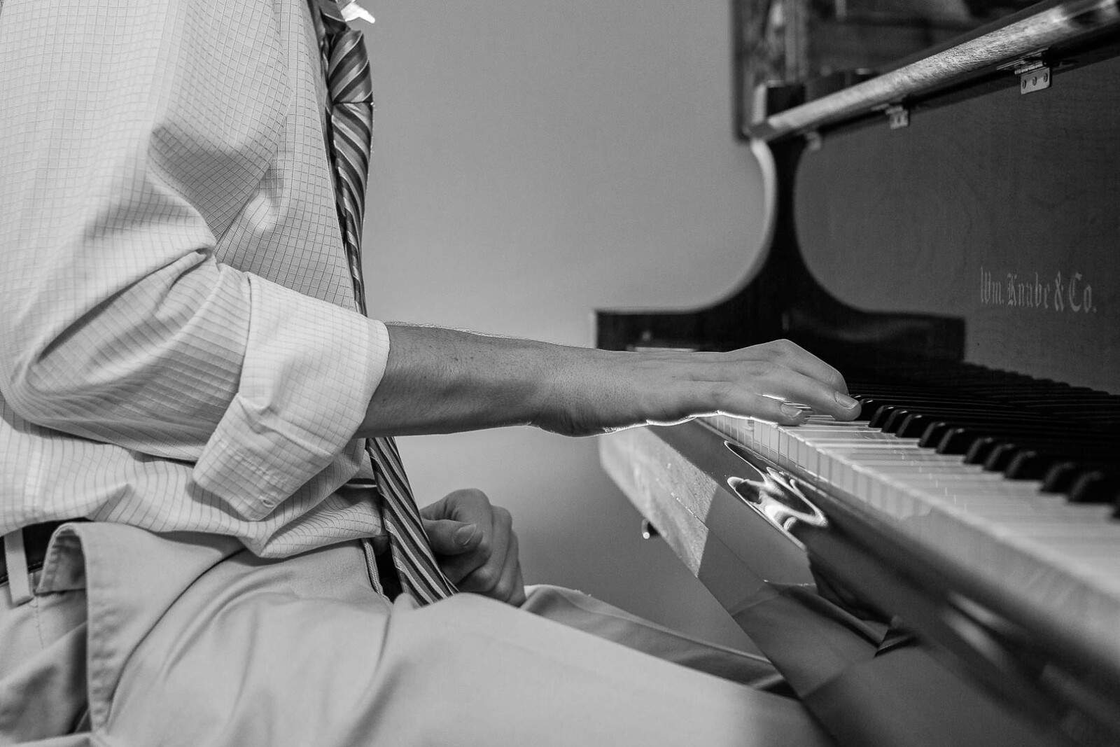 Closeup of hands playing piano