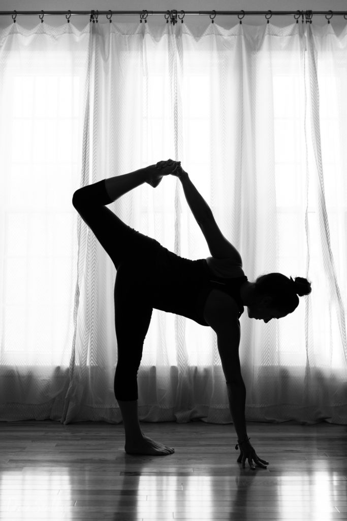 Half Moon variation pose in Nashville yoga photographer branding session in Nashville TN with Whitney Korman