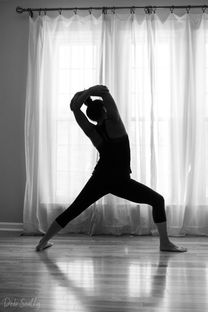 Warrior I variation pose in Nashville yoga photographer branding session in Nashville TN with Whitney Korman