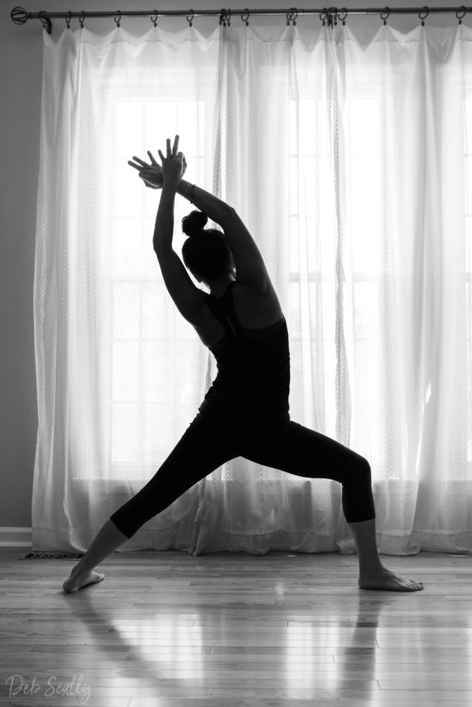 Warrior I with mudra pose in Nashville yoga photographer branding session in Nashville TN with Whitney Korman