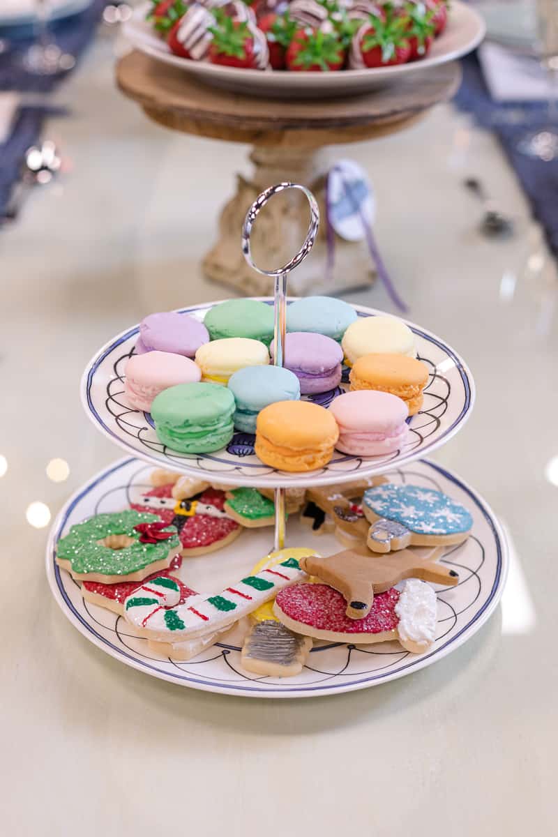 two tier dish with cookies and macarons